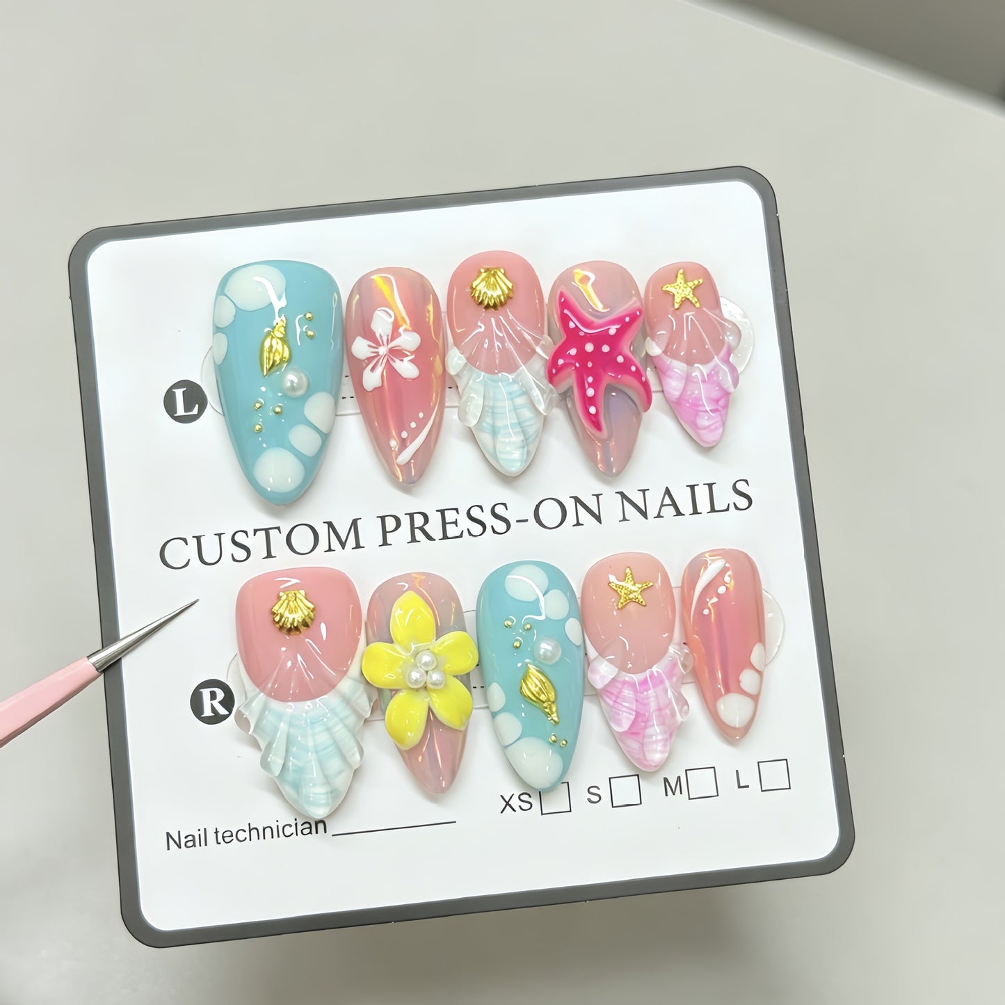 Red starfish handcrafted nail polish with an oceanic style almond-shaped design for a beachy look. Hand-painted nail stickers with intricate designs.