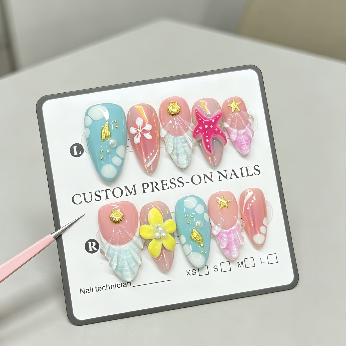 Red starfish handcrafted nail polish with an oceanic style almond-shaped design for a beachy look. Hand-painted nail stickers with intricate designs.