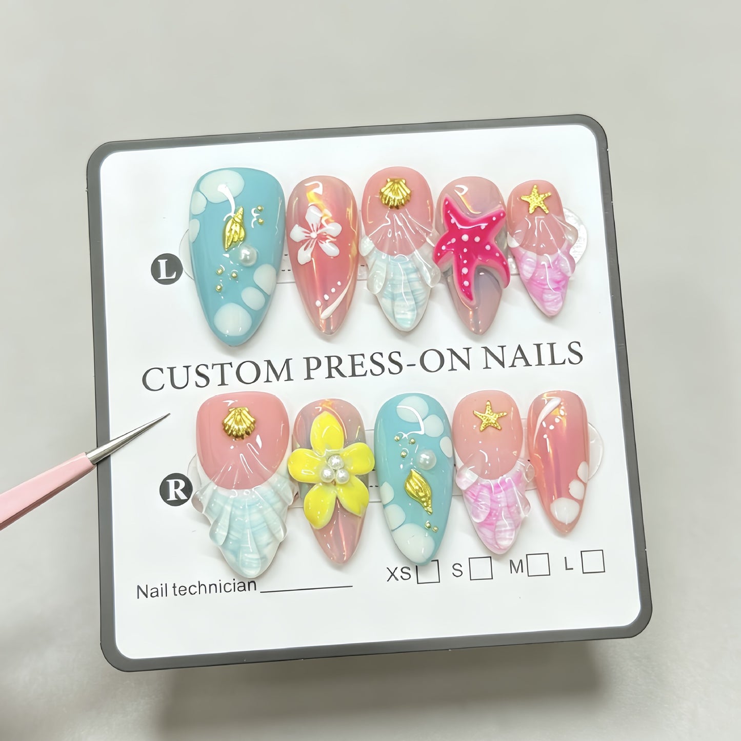 Red starfish handcrafted nail polish with an oceanic style almond-shaped design for a beachy look. Hand-painted nail stickers with intricate designs.