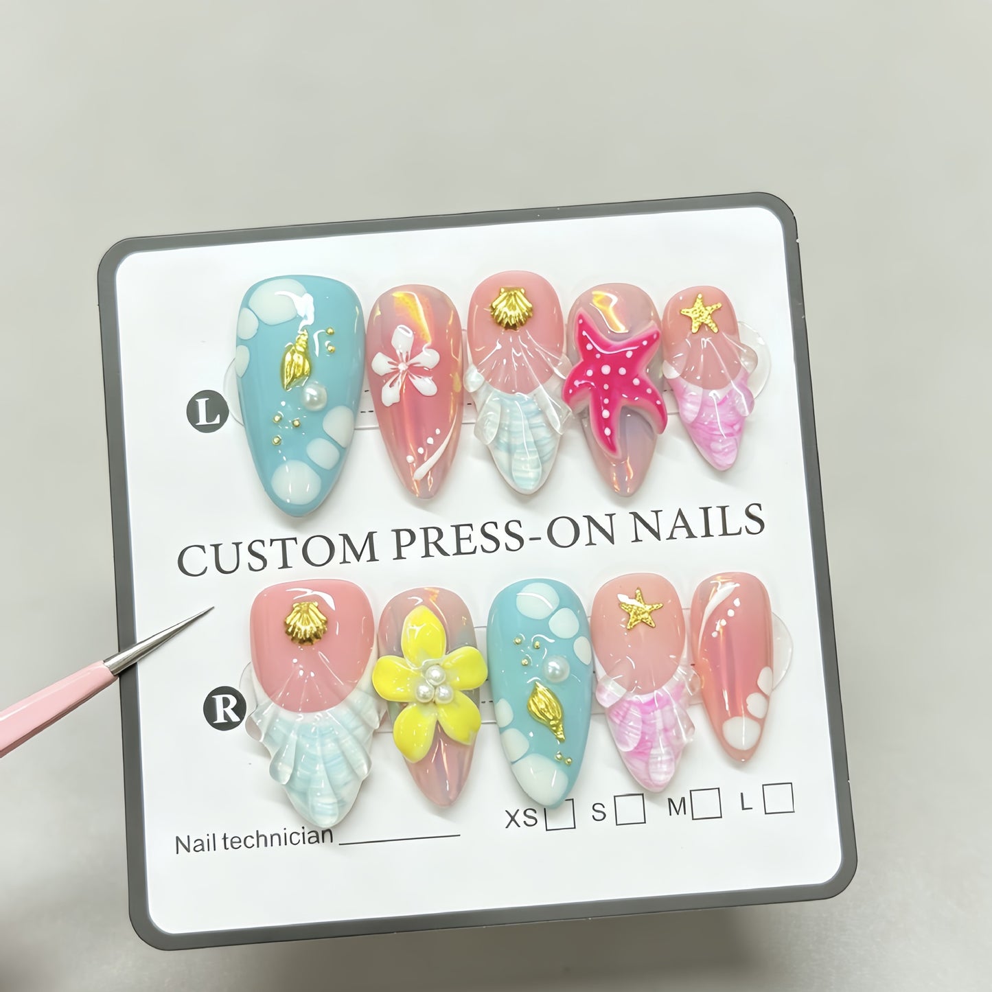 Red starfish handcrafted nail polish with an oceanic style almond-shaped design for a beachy look. Hand-painted nail stickers with intricate designs.
