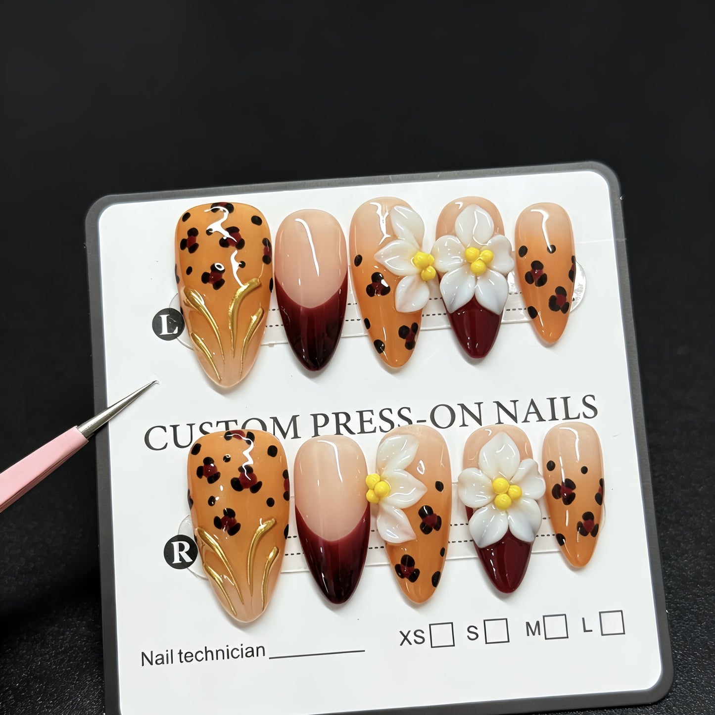 Handmade decorative acrylic nails in autumn color with leopard print and almond-shaped three-dimensional engraved patterns - a best-selling fake nail set for manicure.
