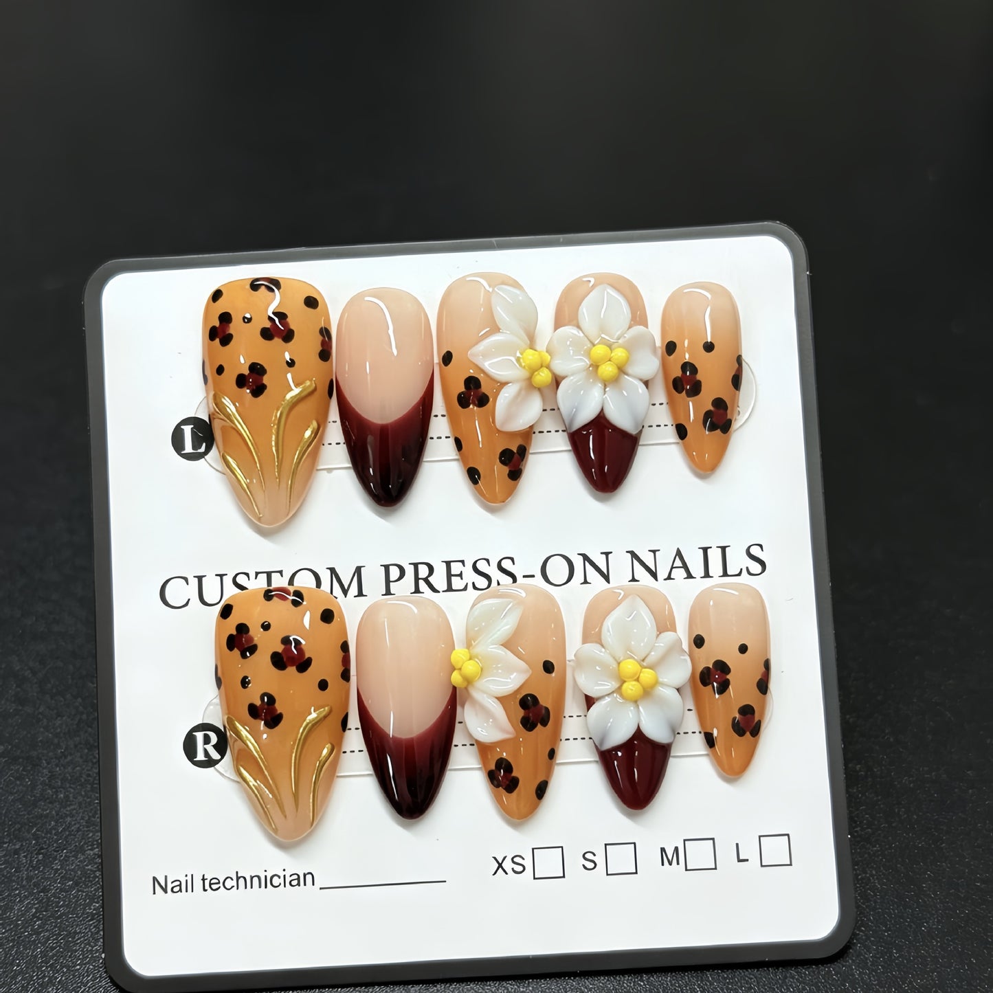 Handmade decorative acrylic nails in autumn color with leopard print and almond-shaped three-dimensional engraved patterns - a best-selling fake nail set for manicure.