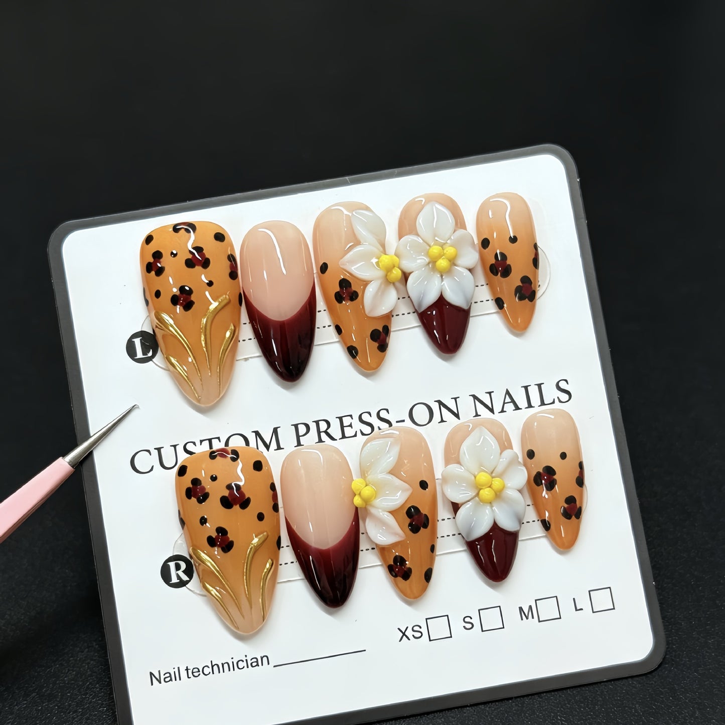 Handmade decorative acrylic nails in autumn color with leopard print and almond-shaped three-dimensional engraved patterns - a best-selling fake nail set for manicure.