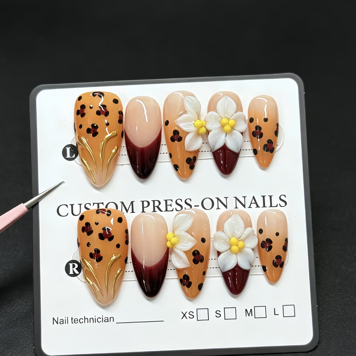 Handmade decorative acrylic nails in autumn color with leopard print and almond-shaped three-dimensional engraved patterns - a best-selling fake nail set for manicure.